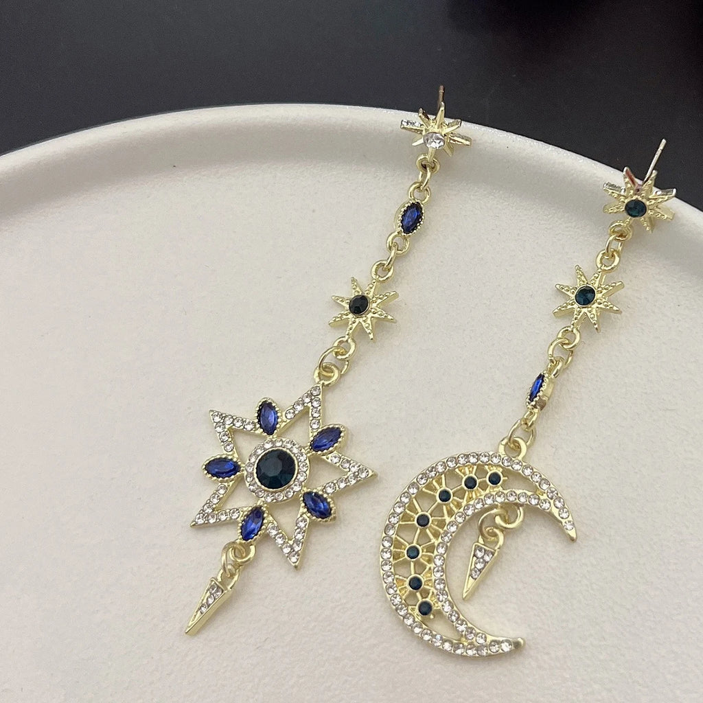 Elegant silver asymmetrical star and moon earrings