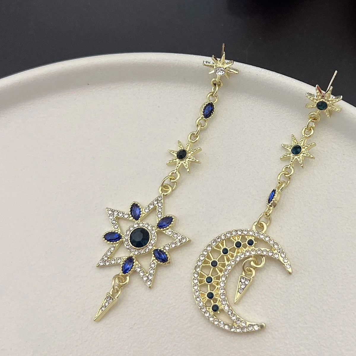 Elegant silver asymmetrical star and moon earrings