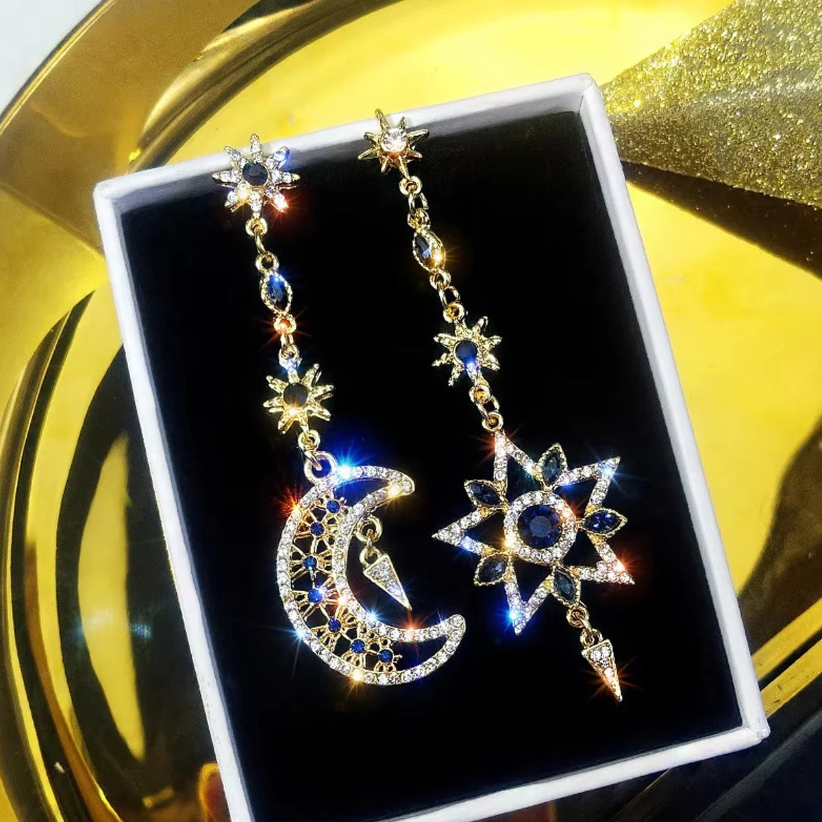 Elegant silver asymmetrical star and moon earrings